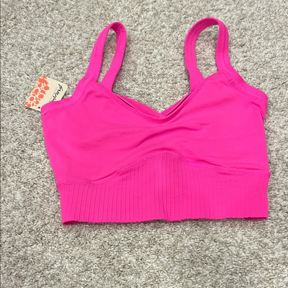 FP Movement by Free People Other - FP Movement NWT hot pink sports bra. XS. Criss cross back and straps